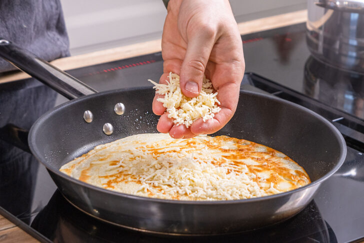 Käse darüber streuen