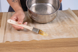 mit Butter bestreichen