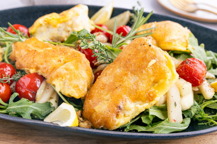 Steinbeißer in Parmesanmantel auf Gemüsebett