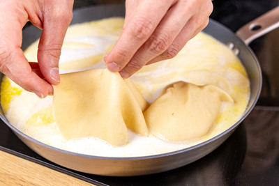 Teigfladen platzieren